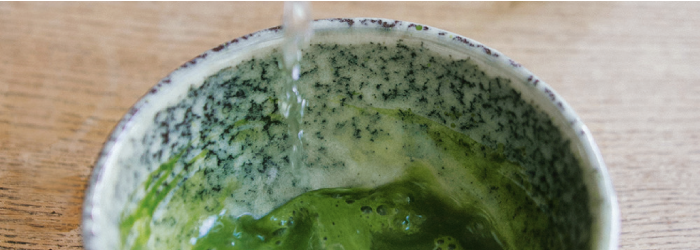 pouring water to prepare a matcha detox