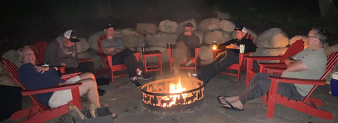Friends around the cabin fire pit