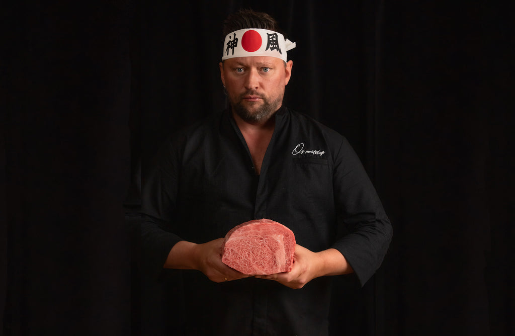 Picture of Chef Ben Elen holding a steak