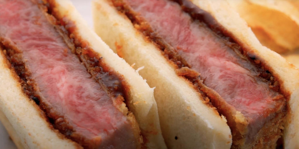 Close up of the beef in a Wagyu Katsu Sando