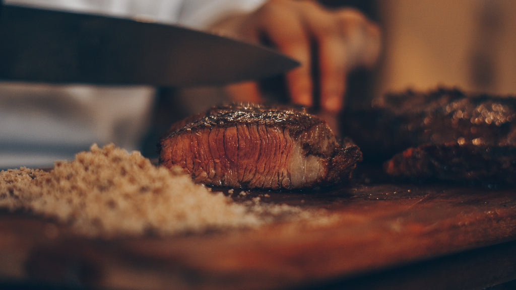 Steak being cut on a plate