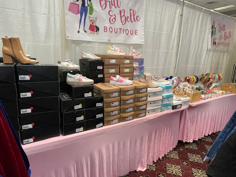 photo of britt and belle boutique's shoe table at tinsel and treasures 2023 holiday shopping event