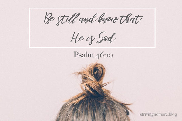 Young woman with hair pulled up in a small bun with Psalm 46:10 above their head