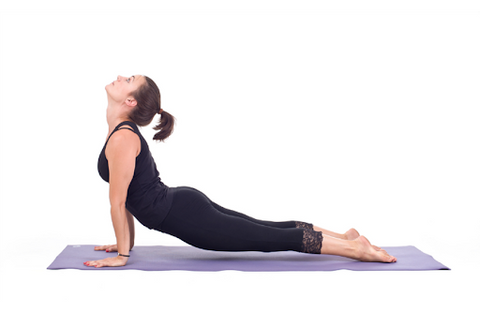 woman exercising stretching on mat 