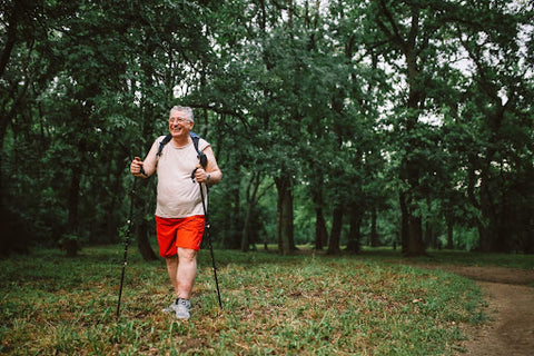 man hiking nature to stay healthy