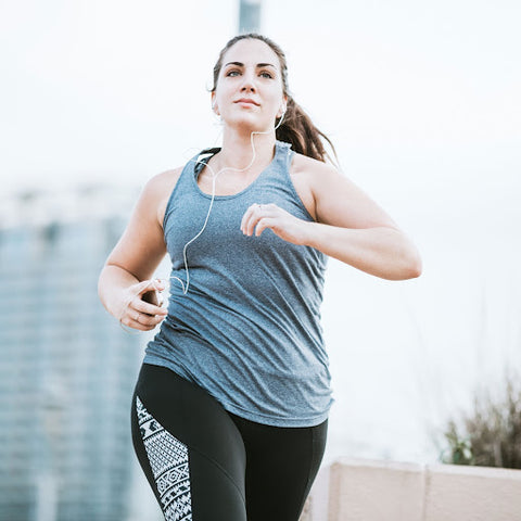 woman running outside to lose weight exercise