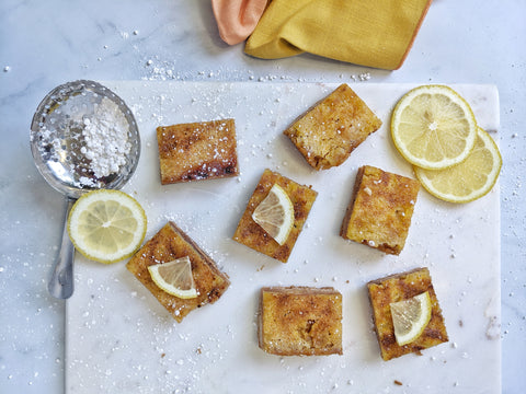 Lemon bars on marble cutting board 