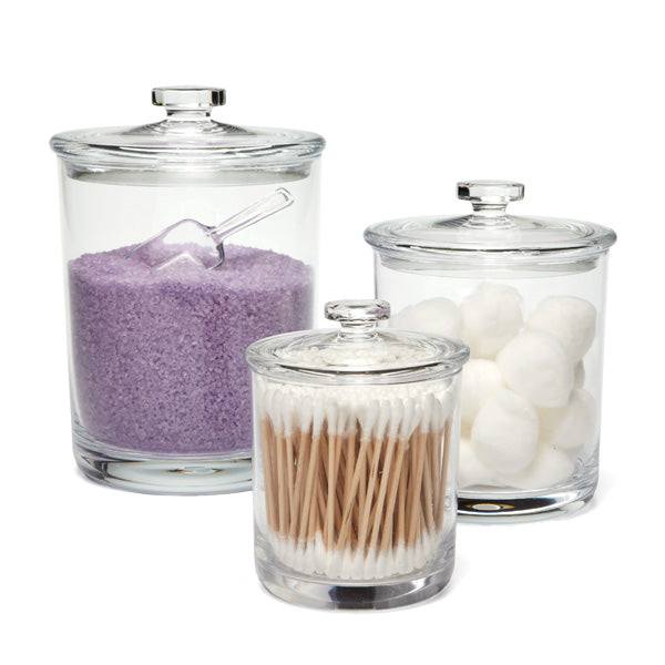 Glass containers are great for holding your more interesting items. Bath salts, q-tips, soaps and cotton balls are all great items for these canisters.