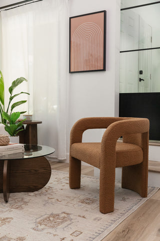 A modern living room featuring warm tones like the Cameron Accent Chair.