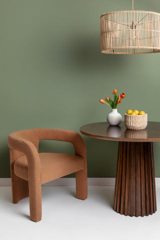 The Cameron Accent Chair styled next to a dining table for a unique look.