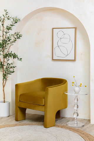 The Ashlyn Tripod Chair paired with the Melodie End Table in a modern living area.