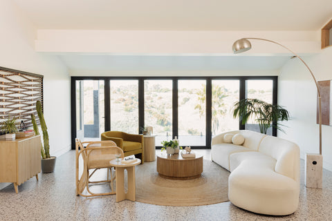 Modern contemporary living room looking out big windows to LA hills.