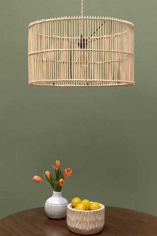 The Lucia Pendant Lampshade styled above a dining table.