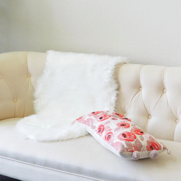 white fur rug on a couch maia homes