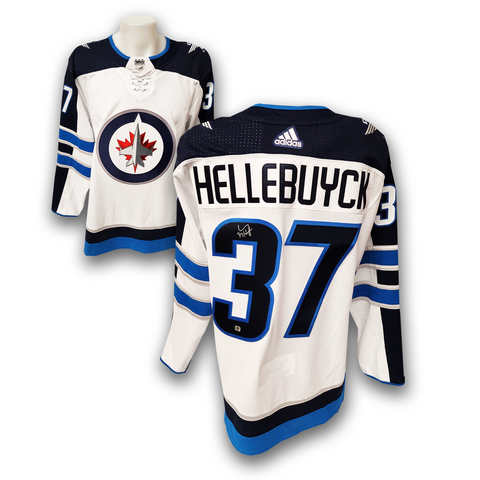 Connor Hellebuyck Winnipeg Jets Unsigned Reverse Retro Jersey in Net Photograph