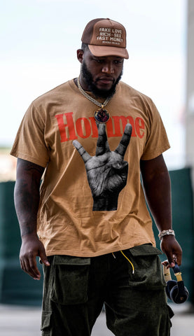 Pro Bowler and Green Bay Packers Defensive Tackle, Kenny Clark seen wearing the Homme Femme Twisted Fingers Tee - Brown/Orange/Cream.