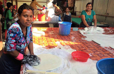 Nepal women hand felting a cat cave.