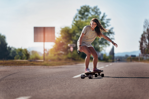 riding electric skateboard kid