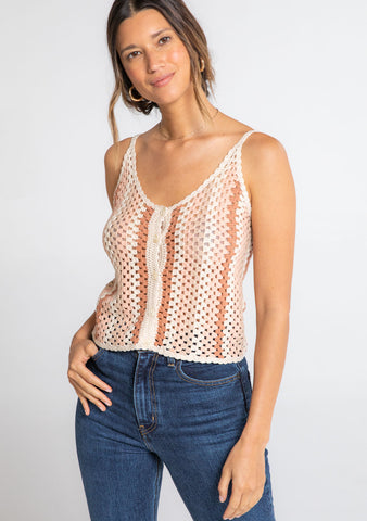 A model wearing a crochet knit tank top with a button front