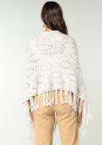 [Color: Heather Cream] A vintage inspired sweater poncho knit from a cream speckled yarn. With a fringed hemline. 