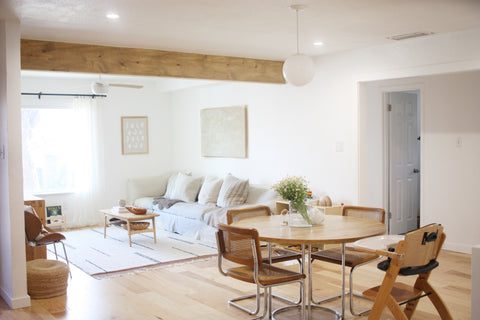 Beige and white living room and dining room space