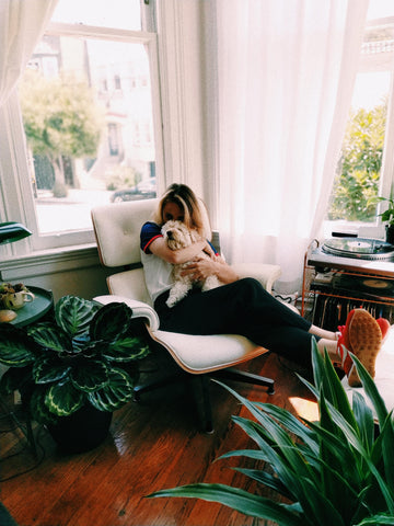 Person and dog enjoying plants