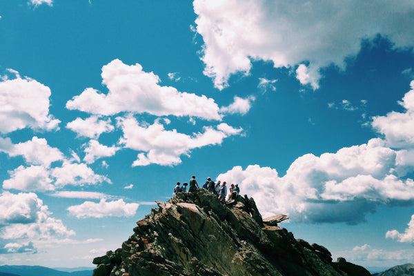 Group of friends at the top of a mountain