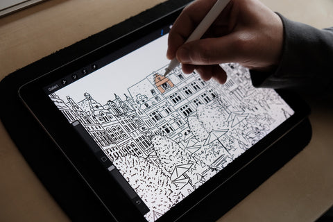 Drawing a city illustration on a tablet