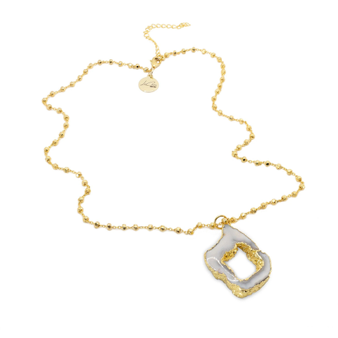 The gold Heavenly Drop Necklace designed and handcrafted by the artisans at LaCkore Couture.