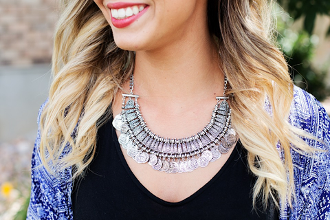 A woman wearing a gorgeous 925 sterling silver necklace. 