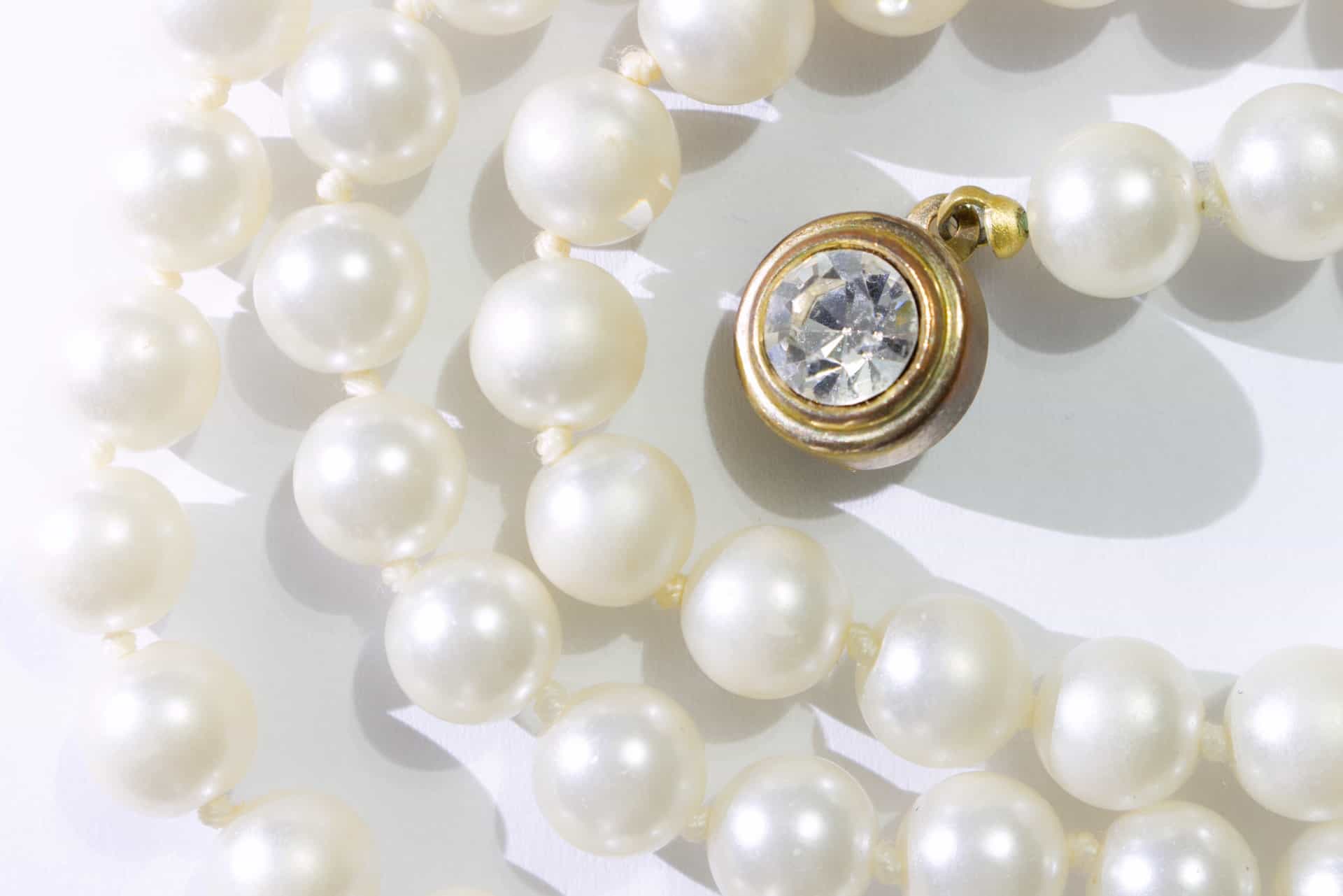 Pearl necklace and diamond charm