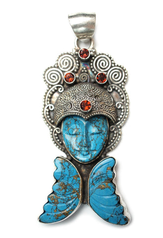 A decorated piece of turquoise jewelry.