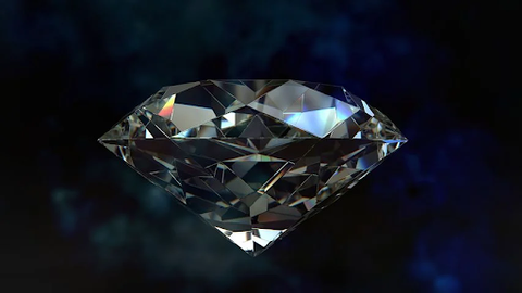 a glittering round diamond floating against a dark background