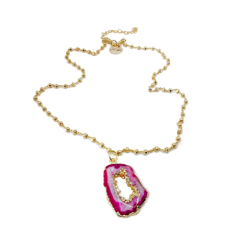 The gold Raspberry Drop Necklace designed and handcrafted by the artisans at LaCkore Couture.