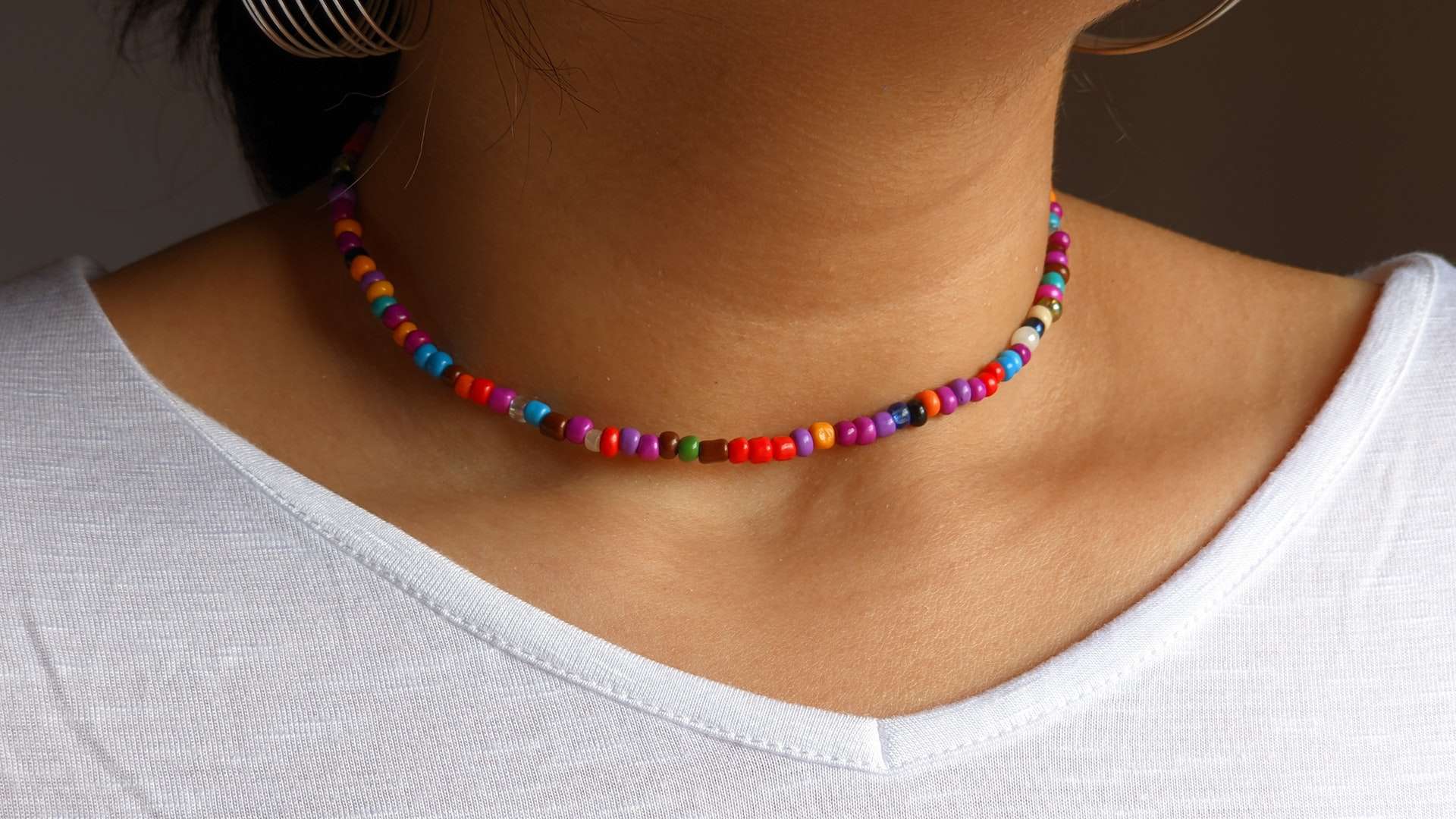 Closeup of tiny, colorful beaded necklace