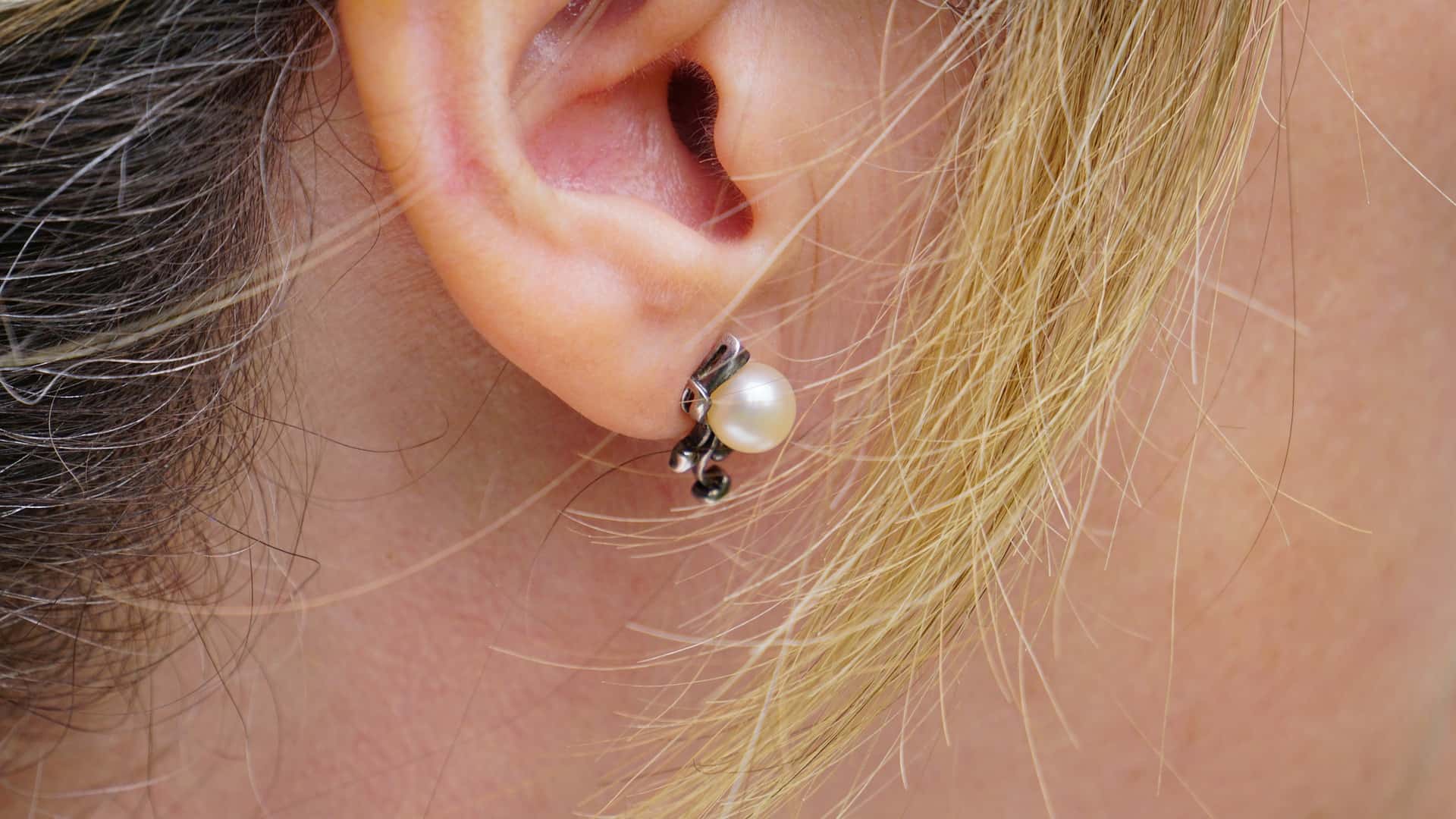 Closeup on a women’s small earring