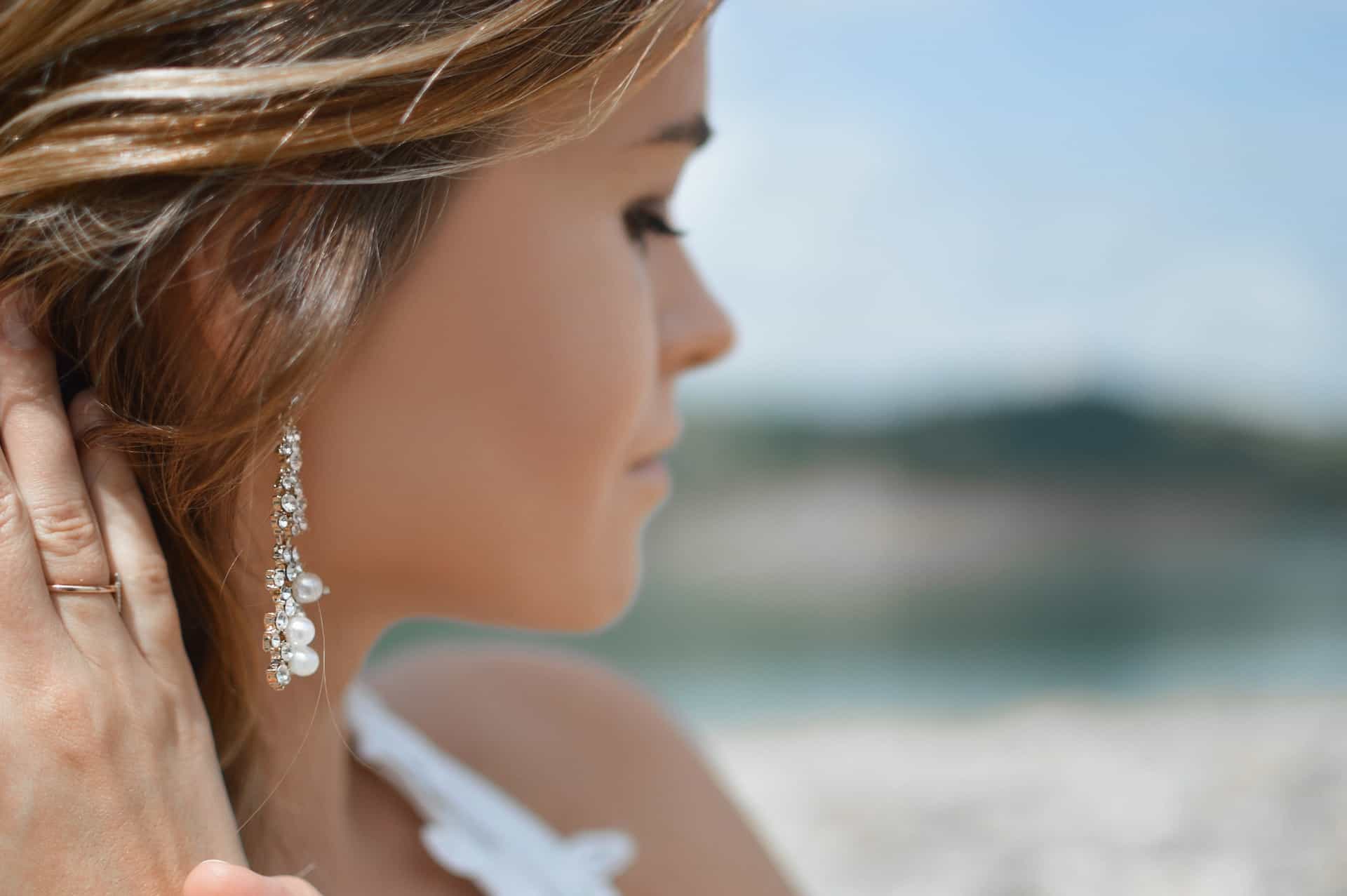 a woman with dangling earrings