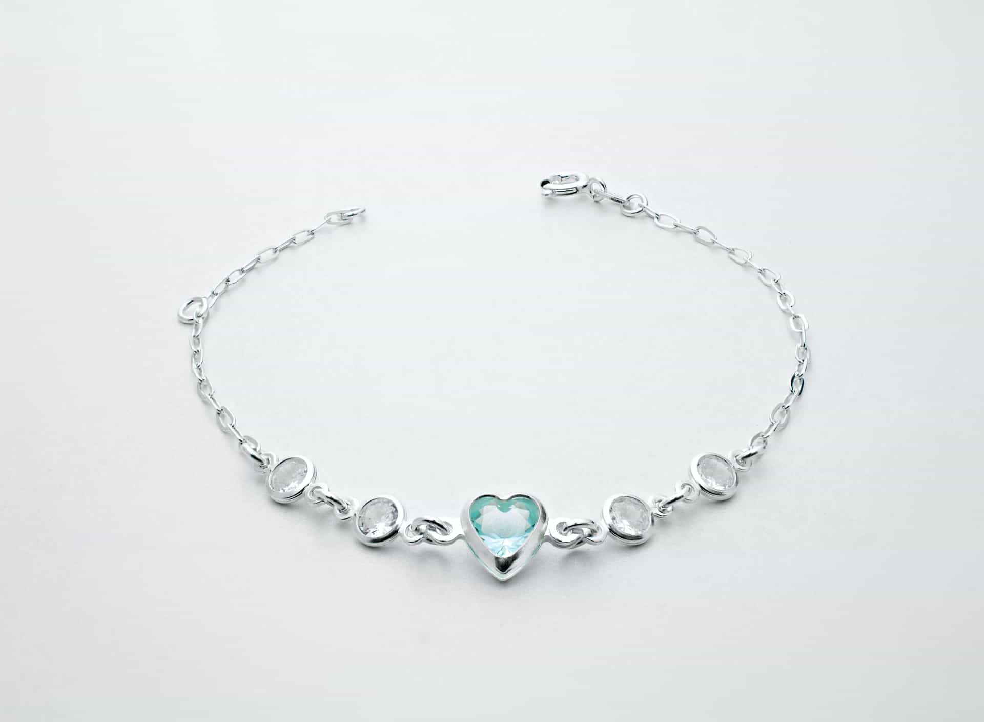 a bracelet with a heart-shaped peridot