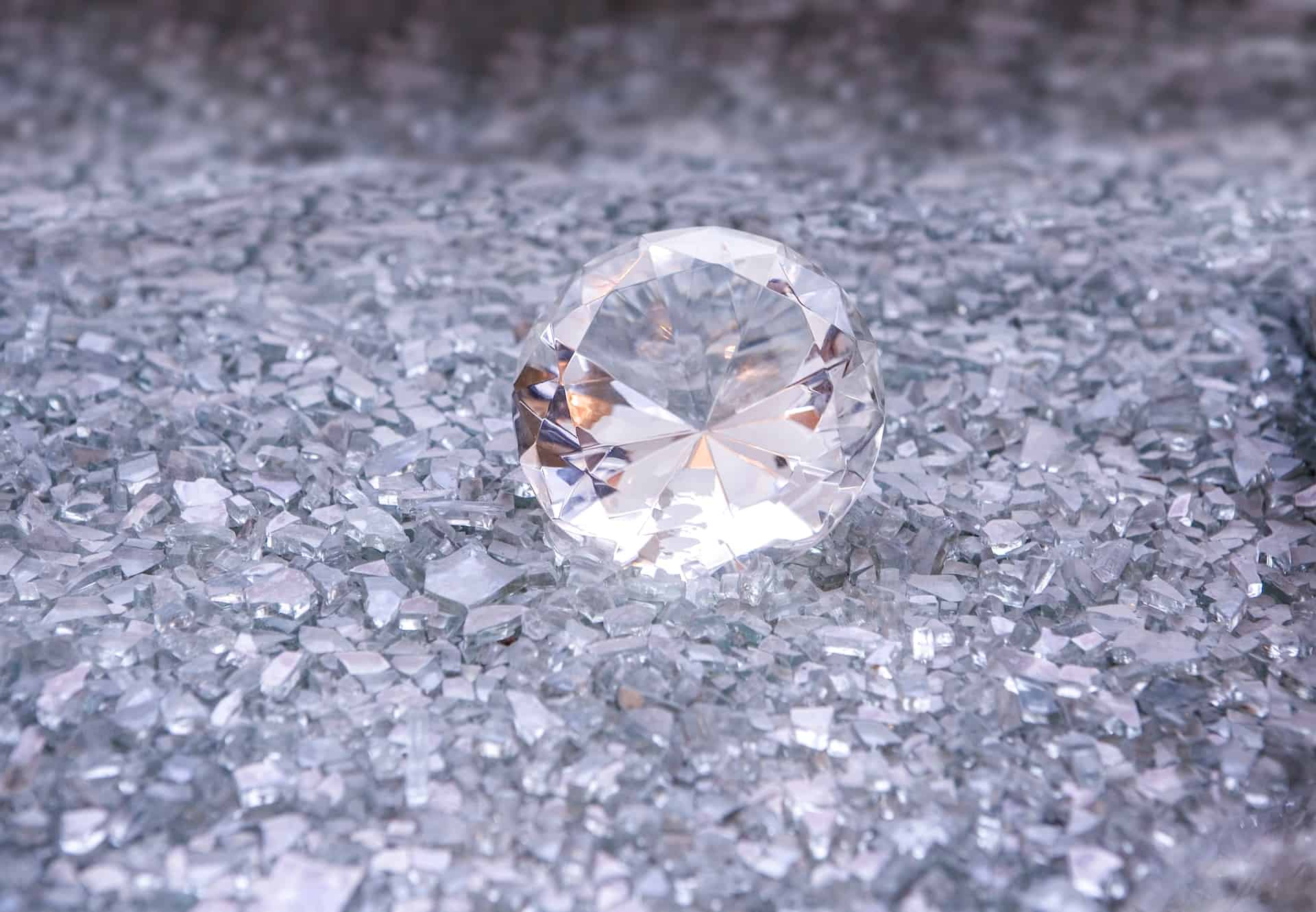 a large diamond with shards of small diamonds
