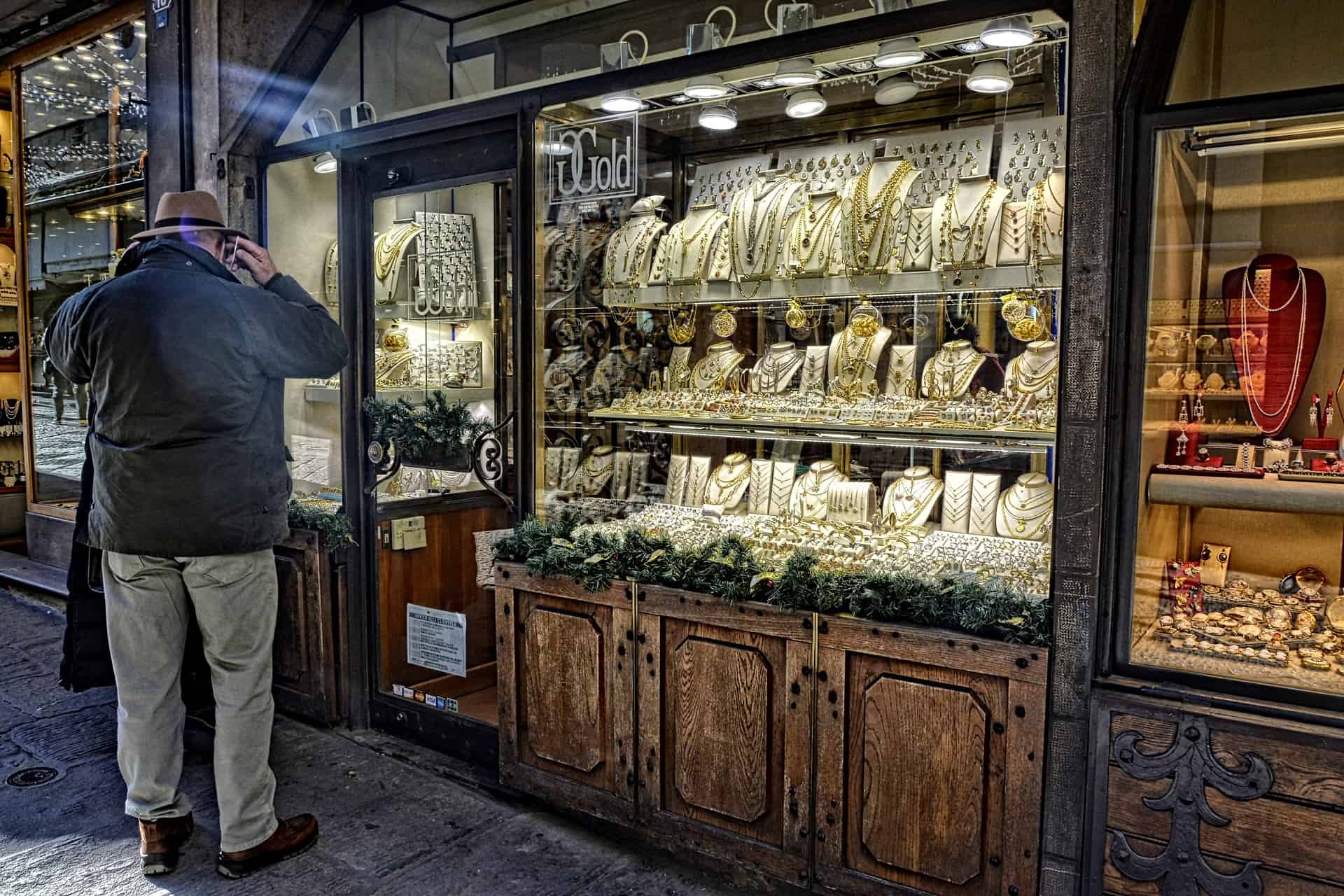 a man standing in front of a jewelry store