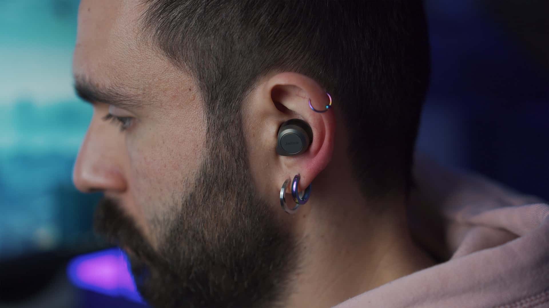 a man with multiple earrings