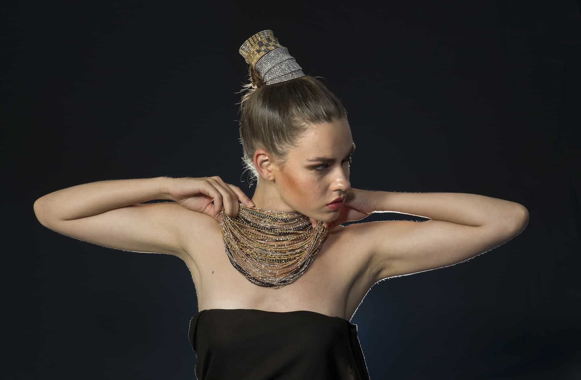 Model Wearing Stacked Necklaces