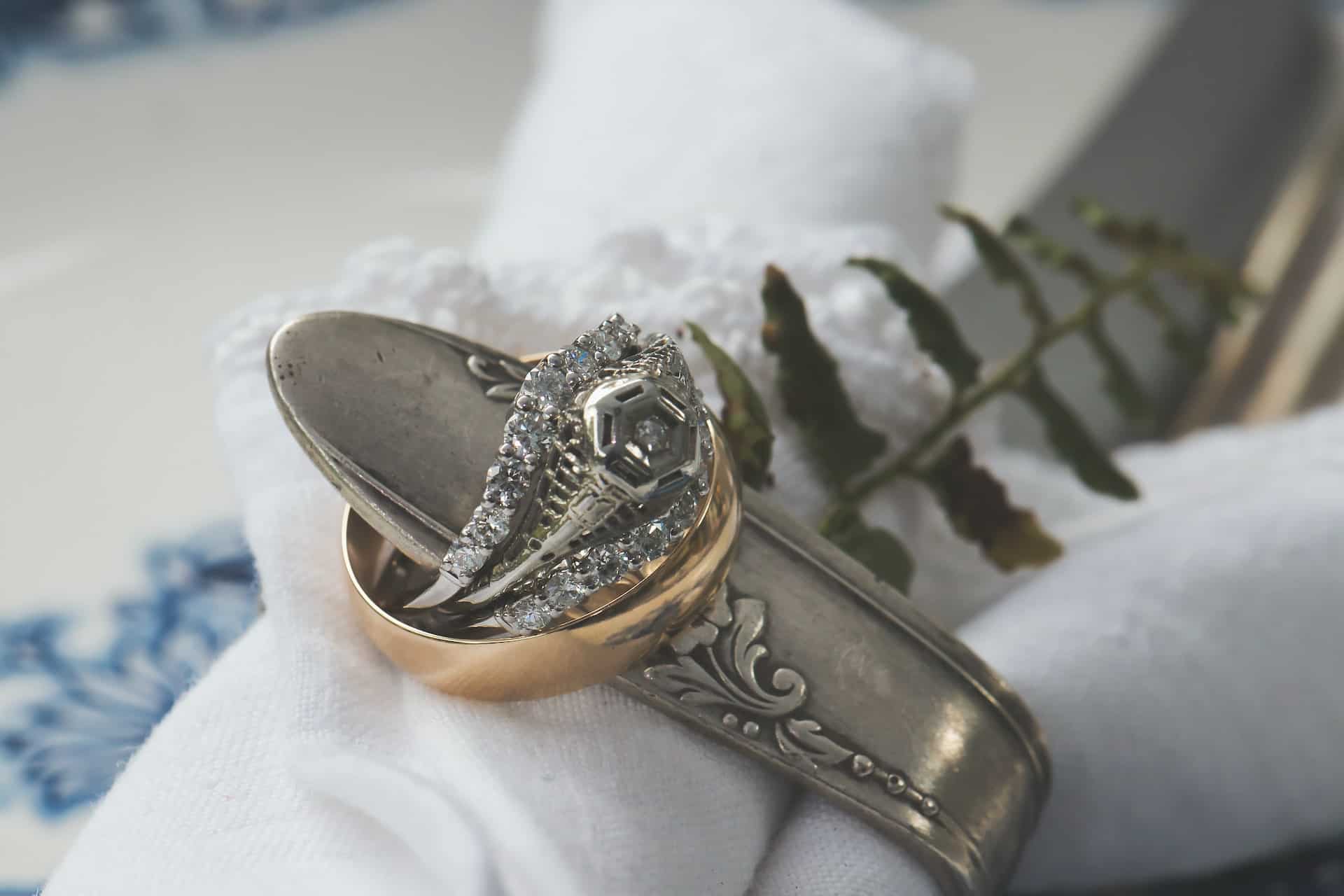 A tarnished silver sun pendant