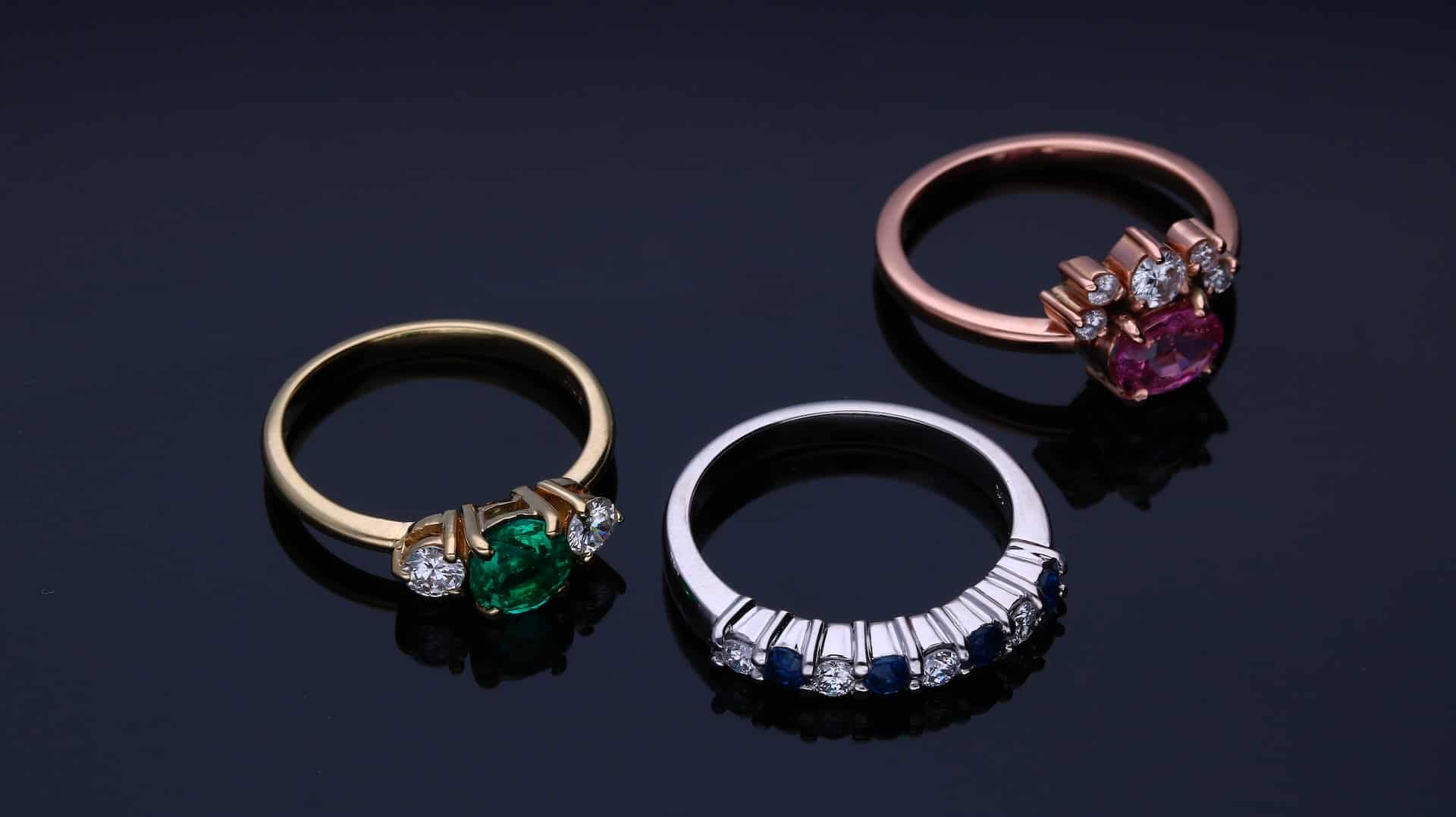 Silver, gold, and rose gold rings
