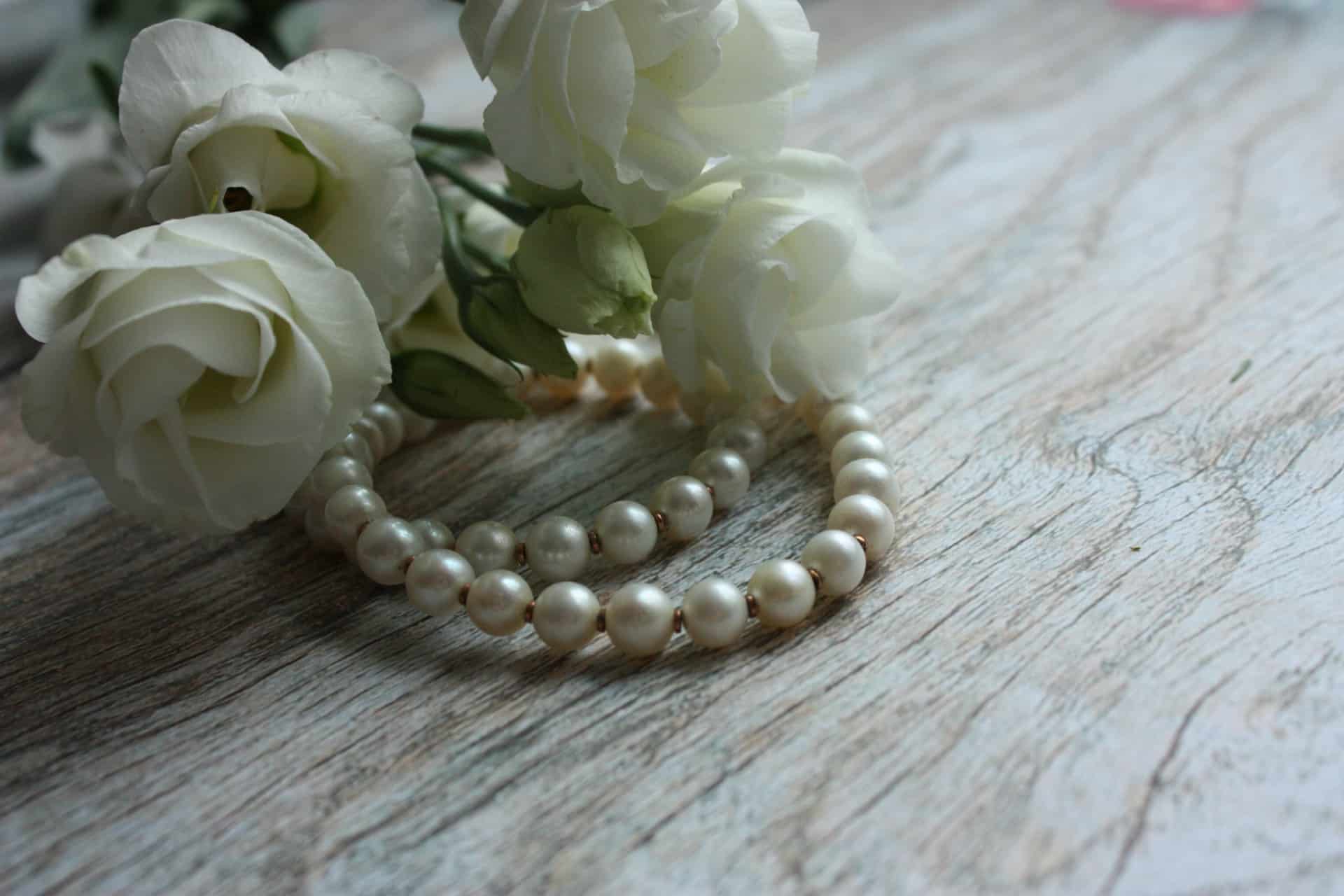 Pearl necklace and white flowers