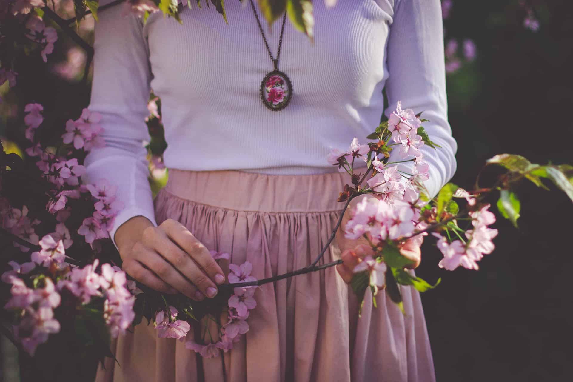 Person showing off homemade necklace