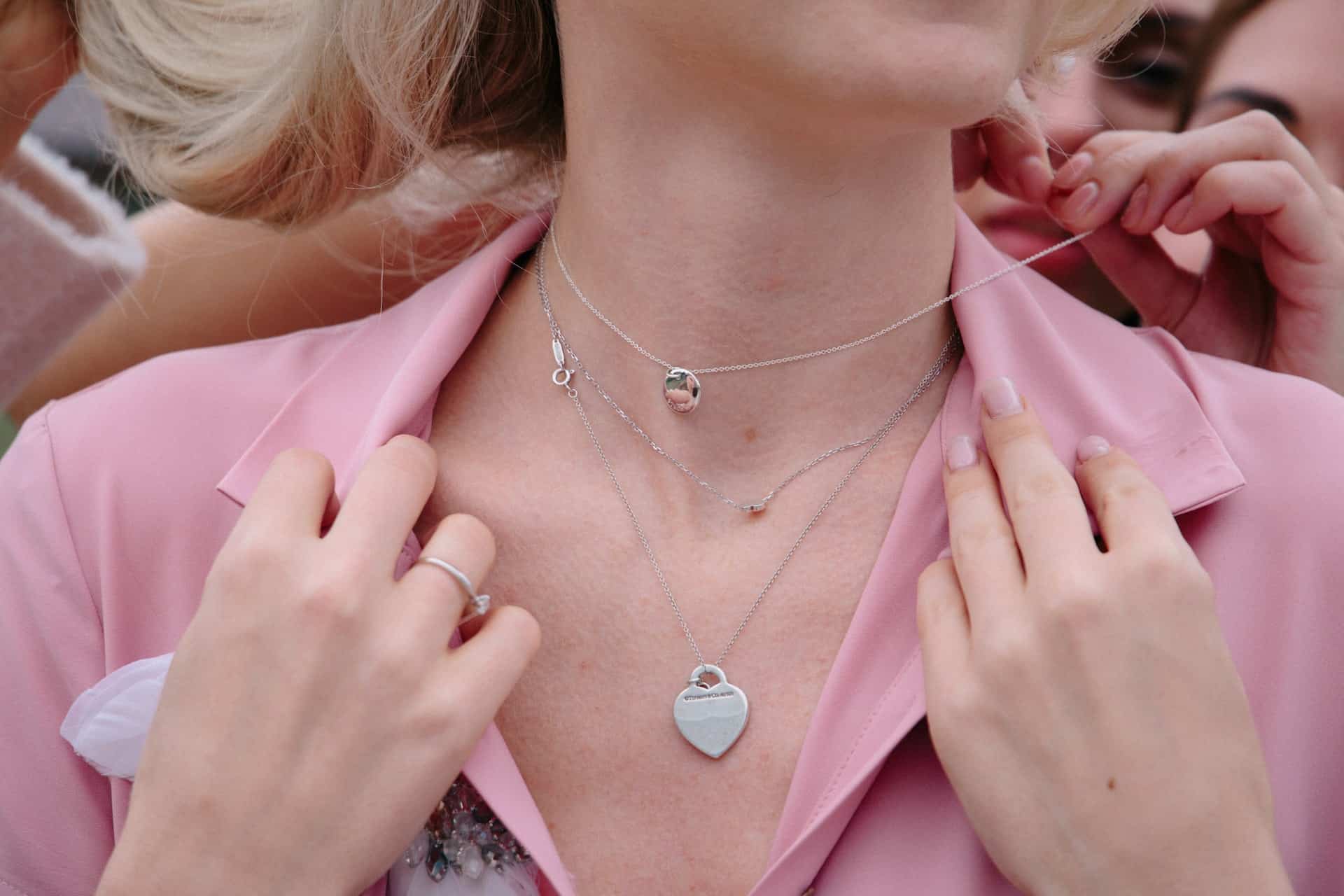 Woman wearing layered necklaces