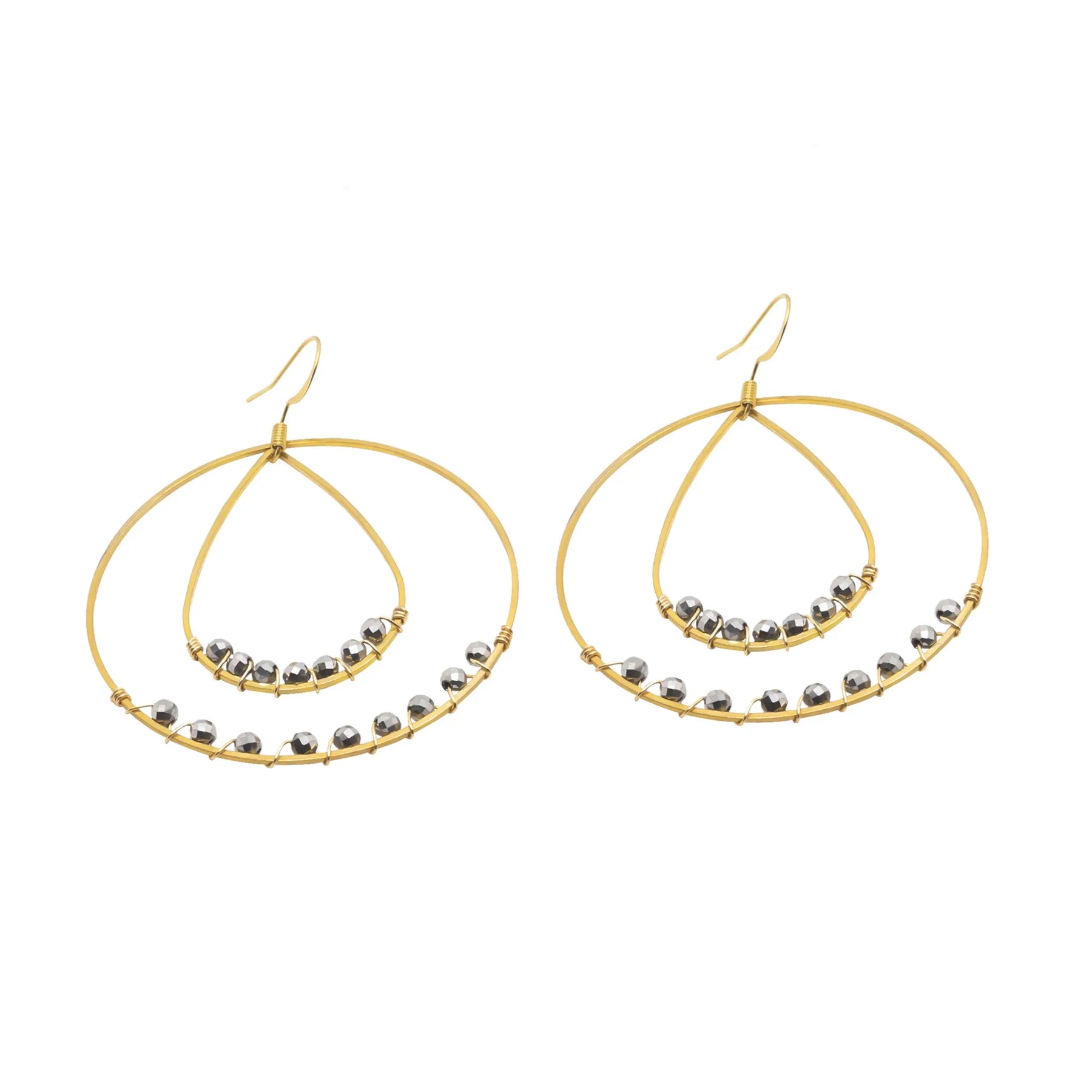 A pair of large circle earrings with beaded accents.