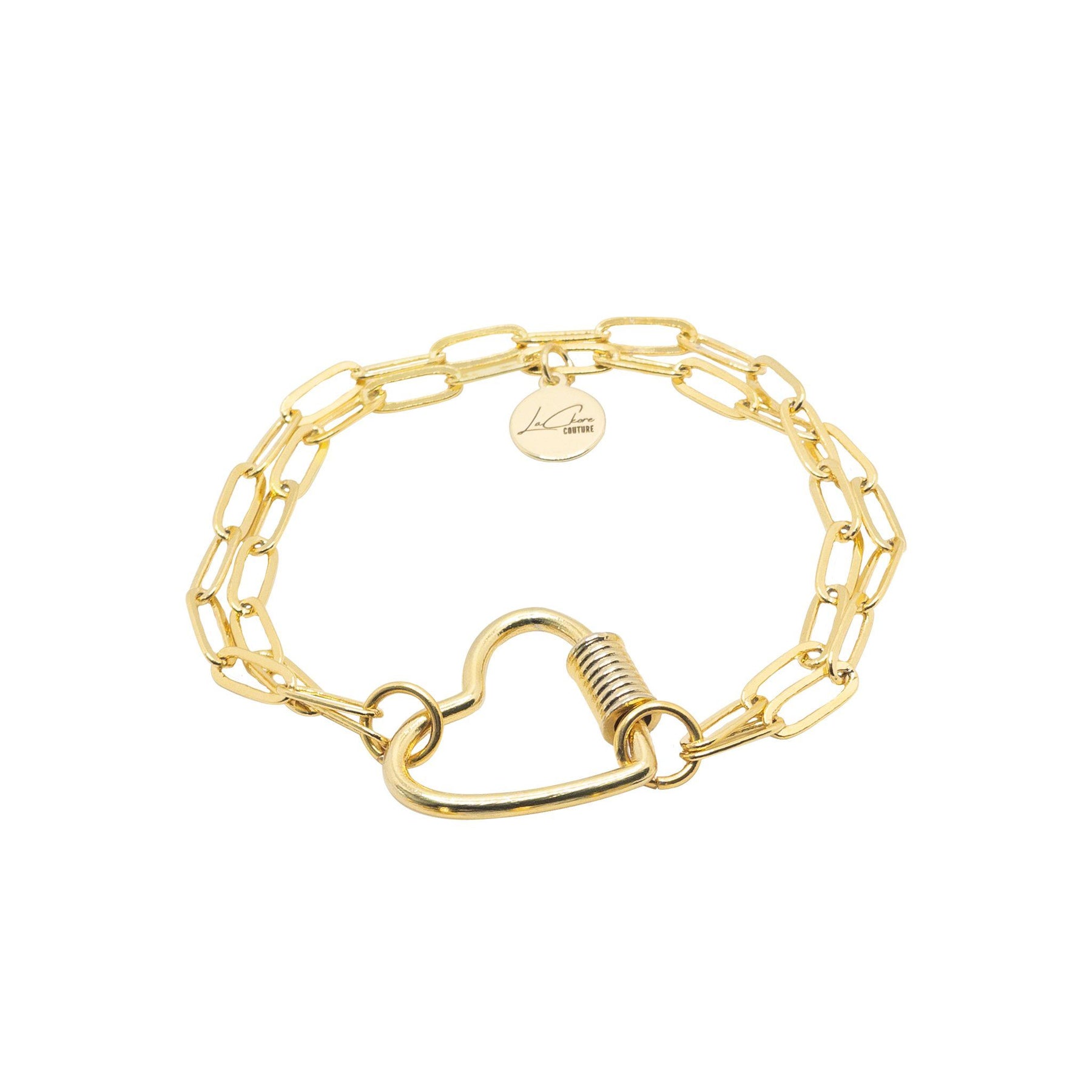 A gold charm bracelet with a heart shaped lock