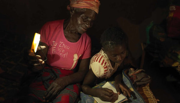 Women and child using solar light